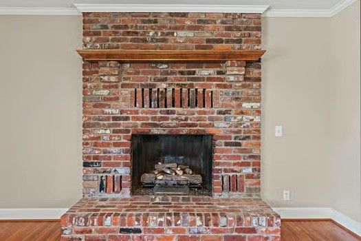 a fireplace with a vase on top of it