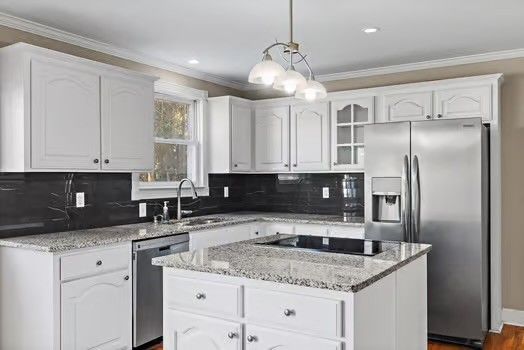 a kitchen with a center island and cabinets