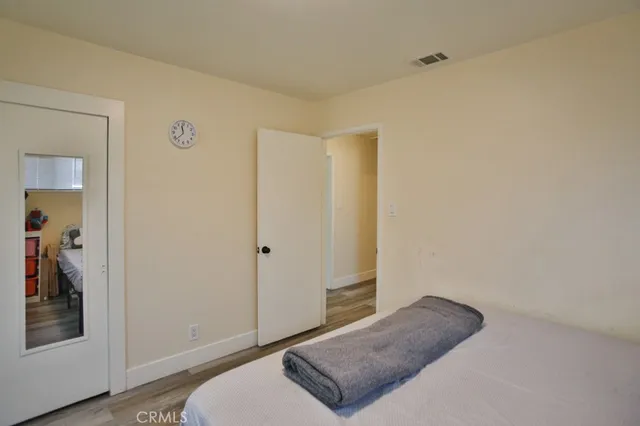 a living room with a couch and dresser