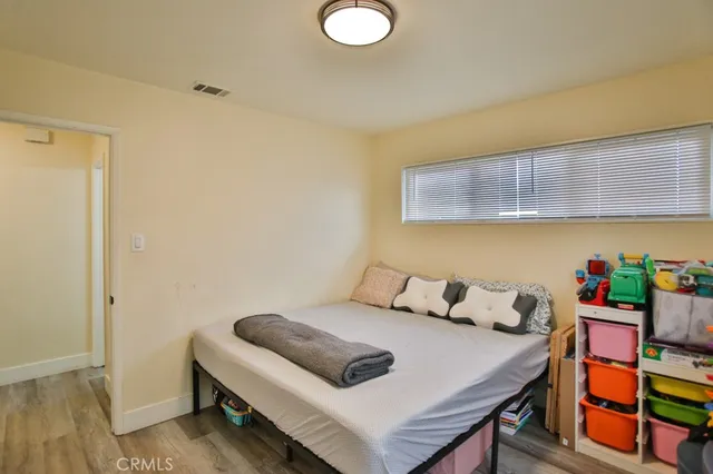 a bedroom with a bed and a dresser