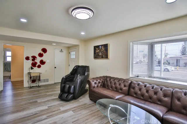 a living room with furniture and a large window
