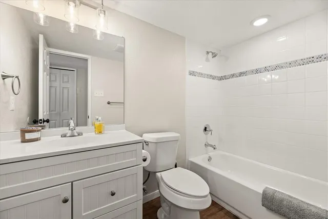a bathroom with a sink a toilet and a bathtub