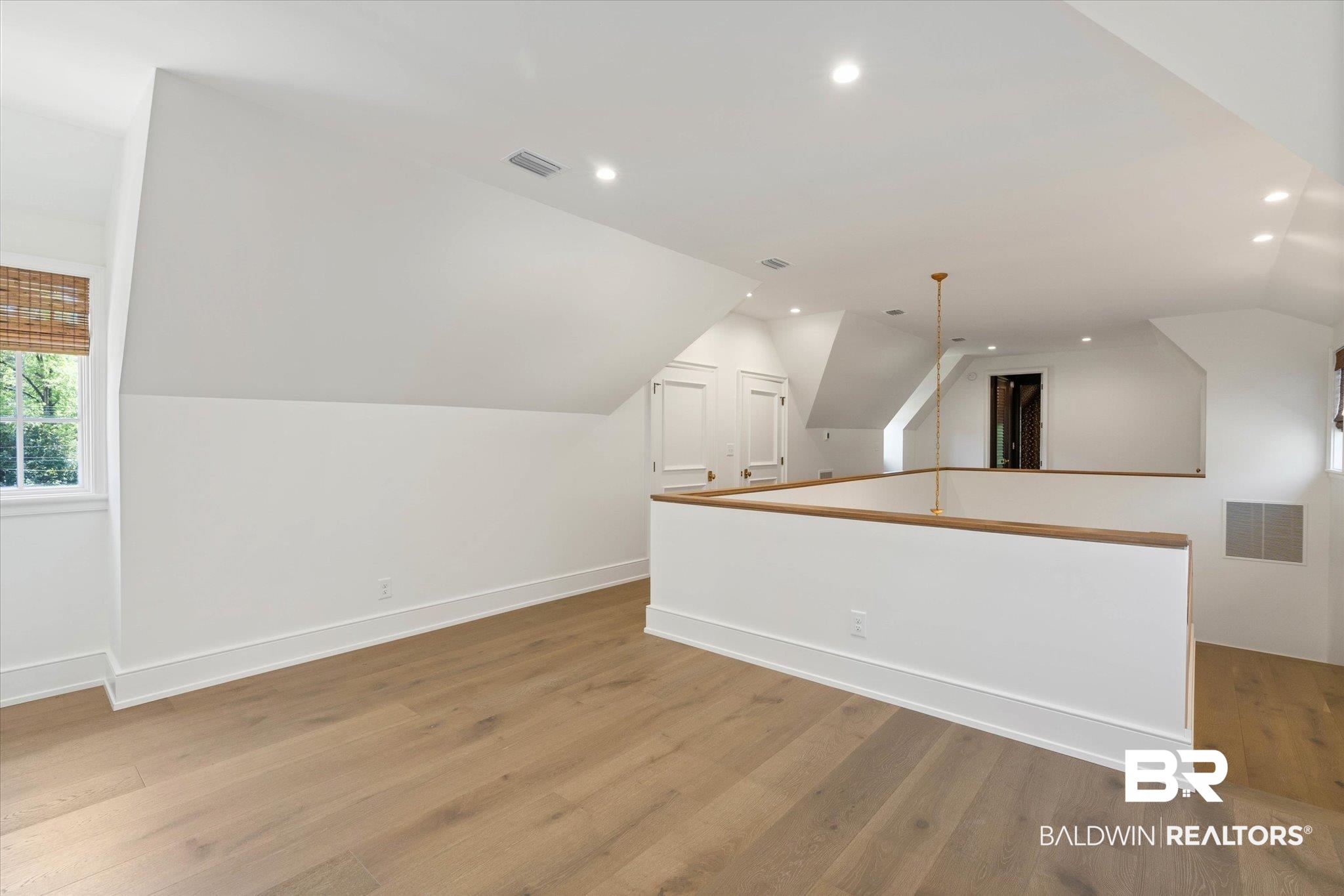 3 Canterbury Park Mobile, AL 36608 - Photo 26 of 43 Additional living space featuring vaulted ceiling, light wood finished floors, recessed lighting, and baseboards