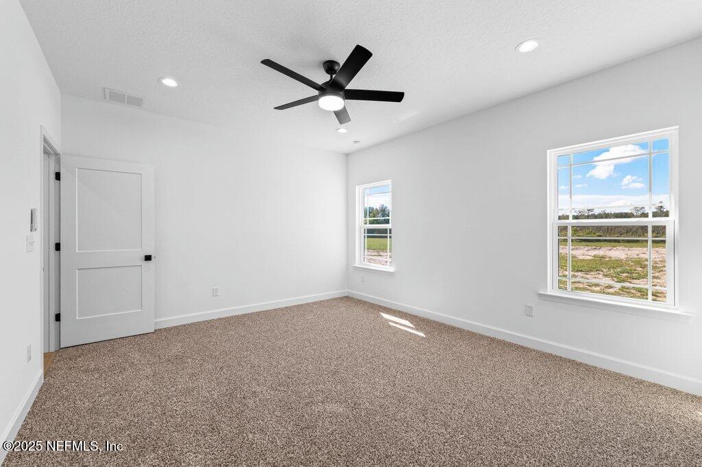 14299 Saddle Ridge Road Macclenny, FL 32063 - Photo 17 of 35 a view of an empty room with a window