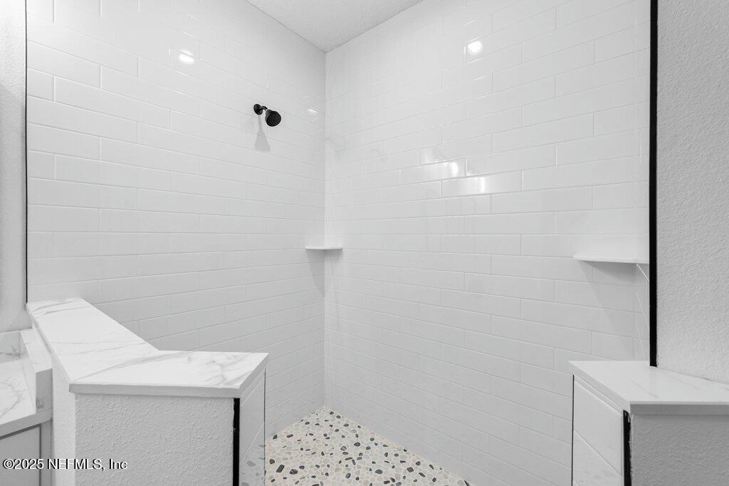 14299 Saddle Ridge Road Macclenny, FL 32063 - Photo 21 of 35 a bathroom with a shower
