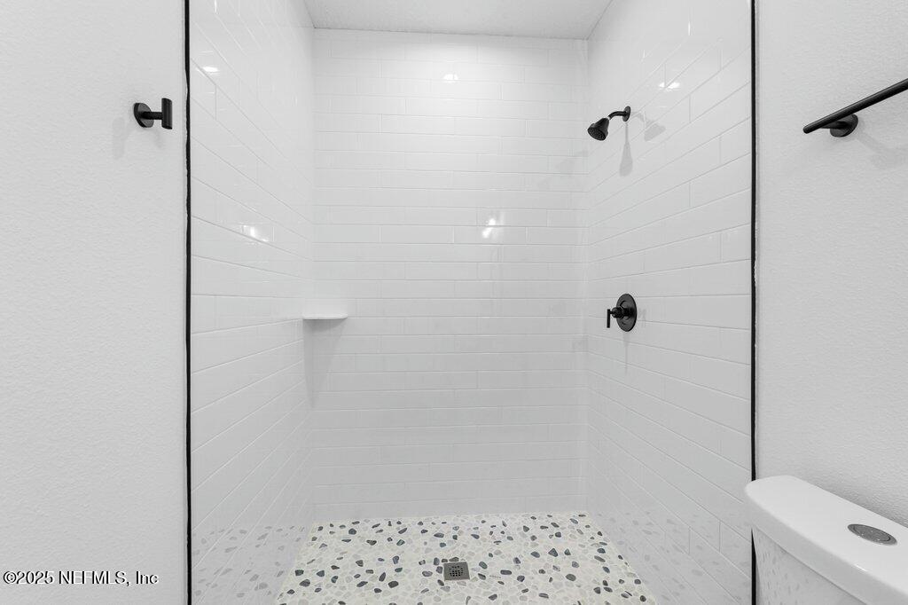 14299 Saddle Ridge Road Macclenny, FL 32063 - Photo 30 of 35 a bathroom with a shower