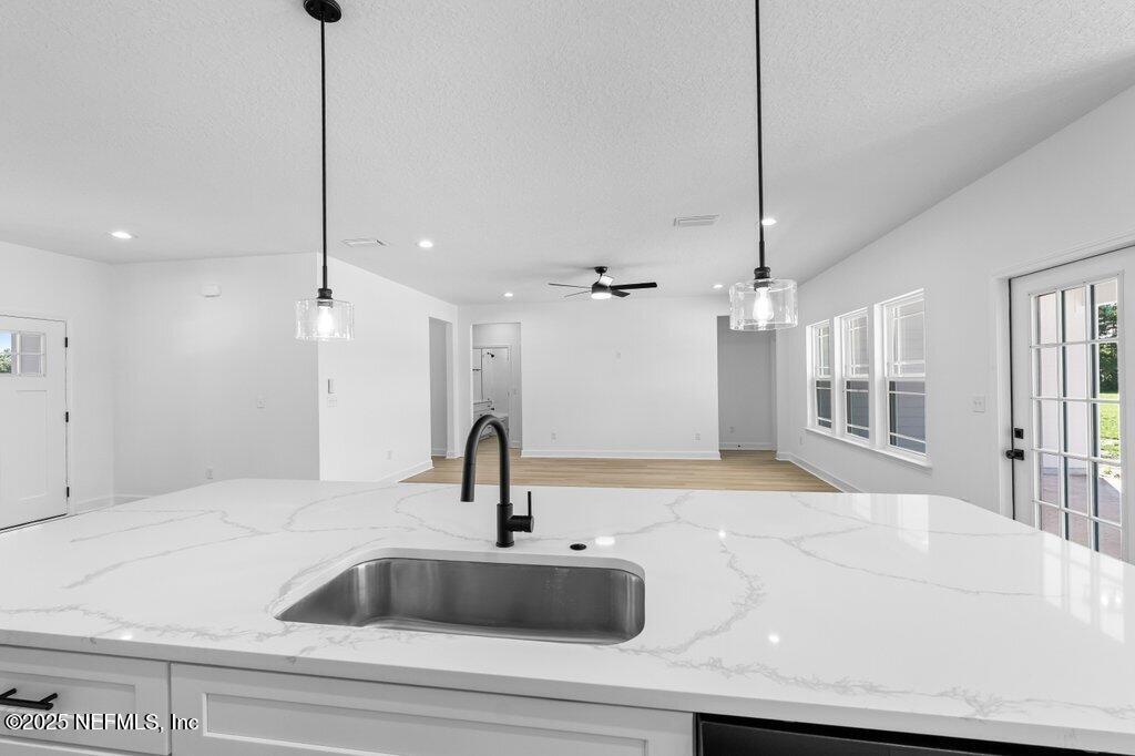 14299 Saddle Ridge Road Macclenny, FL 32063 - Photo 7 of 35 a bathroom with a sink and a mirror