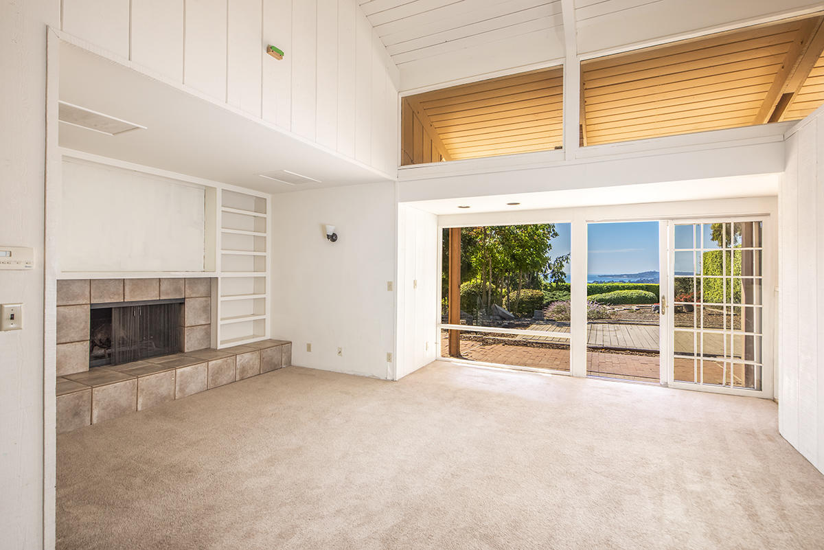 347 Ridgecrest Drive Montecito, CA 93108 - Photo 4 of 10 an empty room with windows and a fireplace