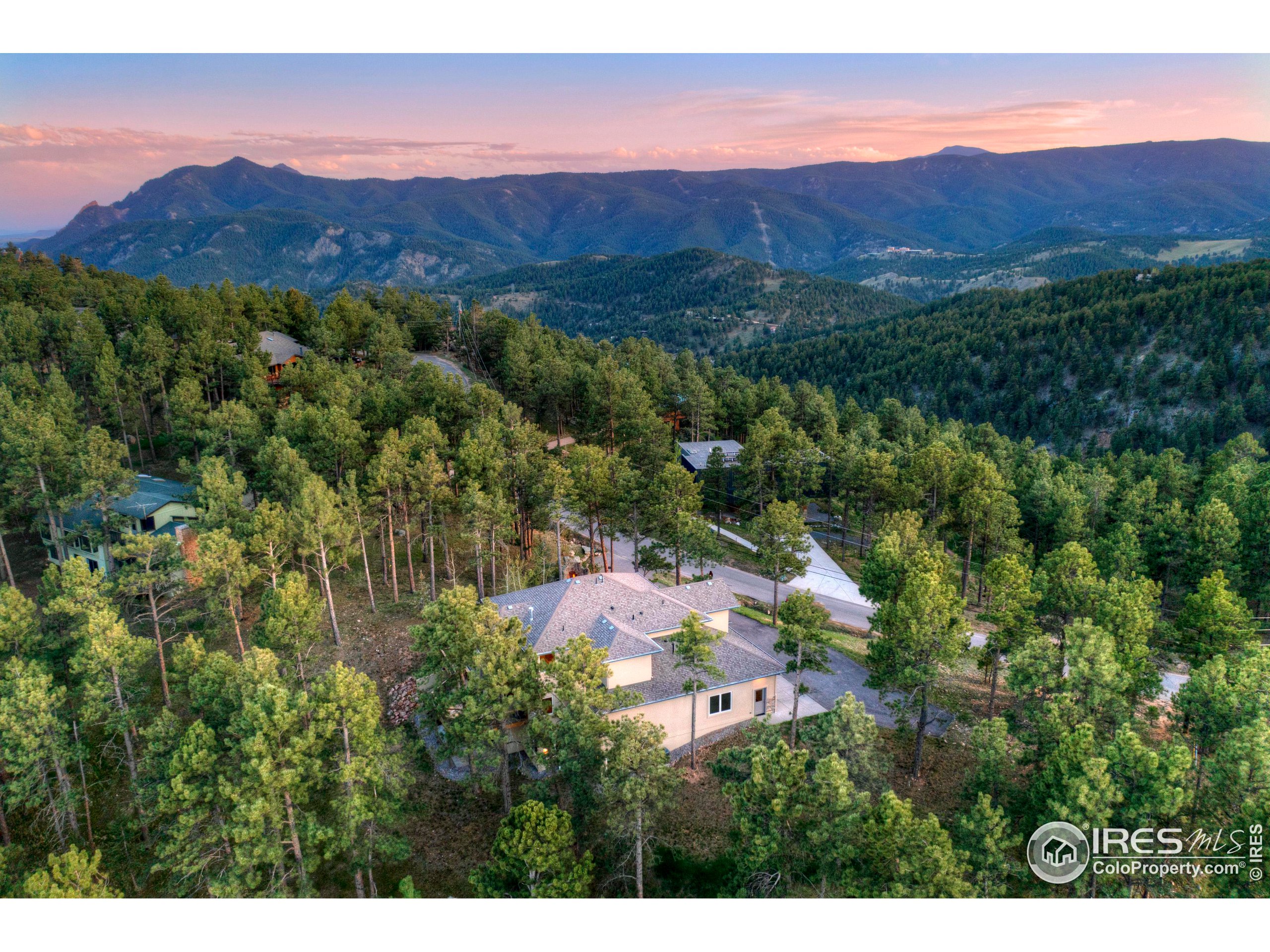 75 Alder Lane Boulder, CO 80304 - Photo 11 of 40 a view of a lush green hillside and houses