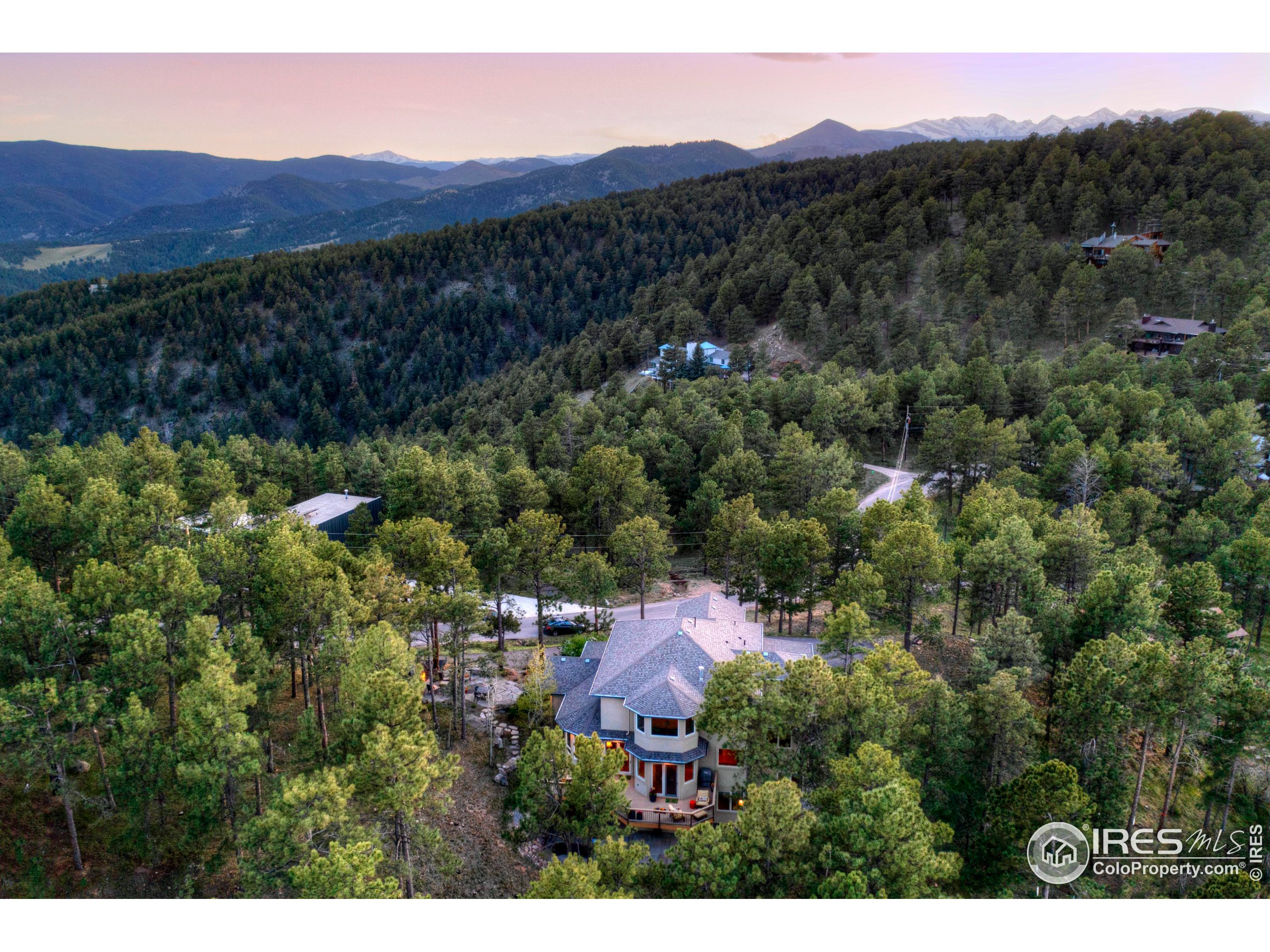 75 Alder Lane Boulder, CO 80304 - Photo 17 of 40 a view of a lush green hillside and a houses