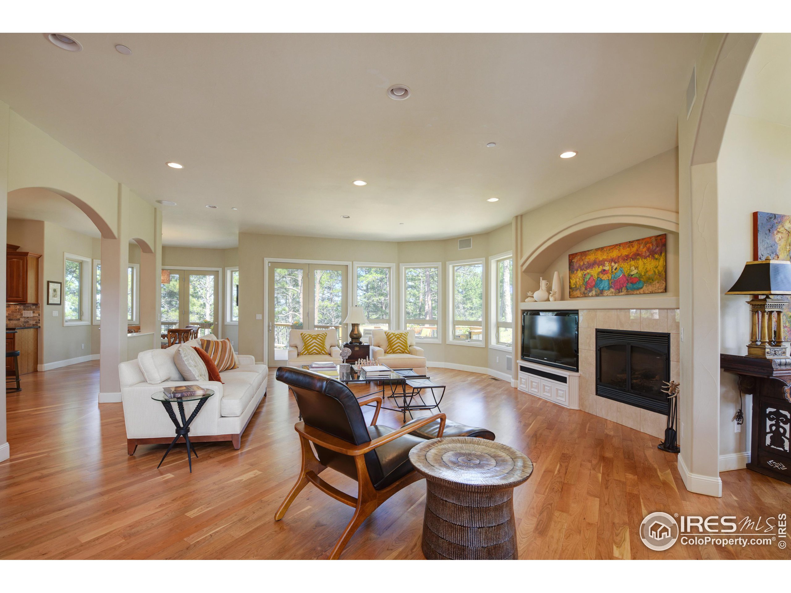 75 Alder Lane Boulder, CO 80304 - Photo 2 of 40 a living room with furniture a fireplace and a flat screen tv