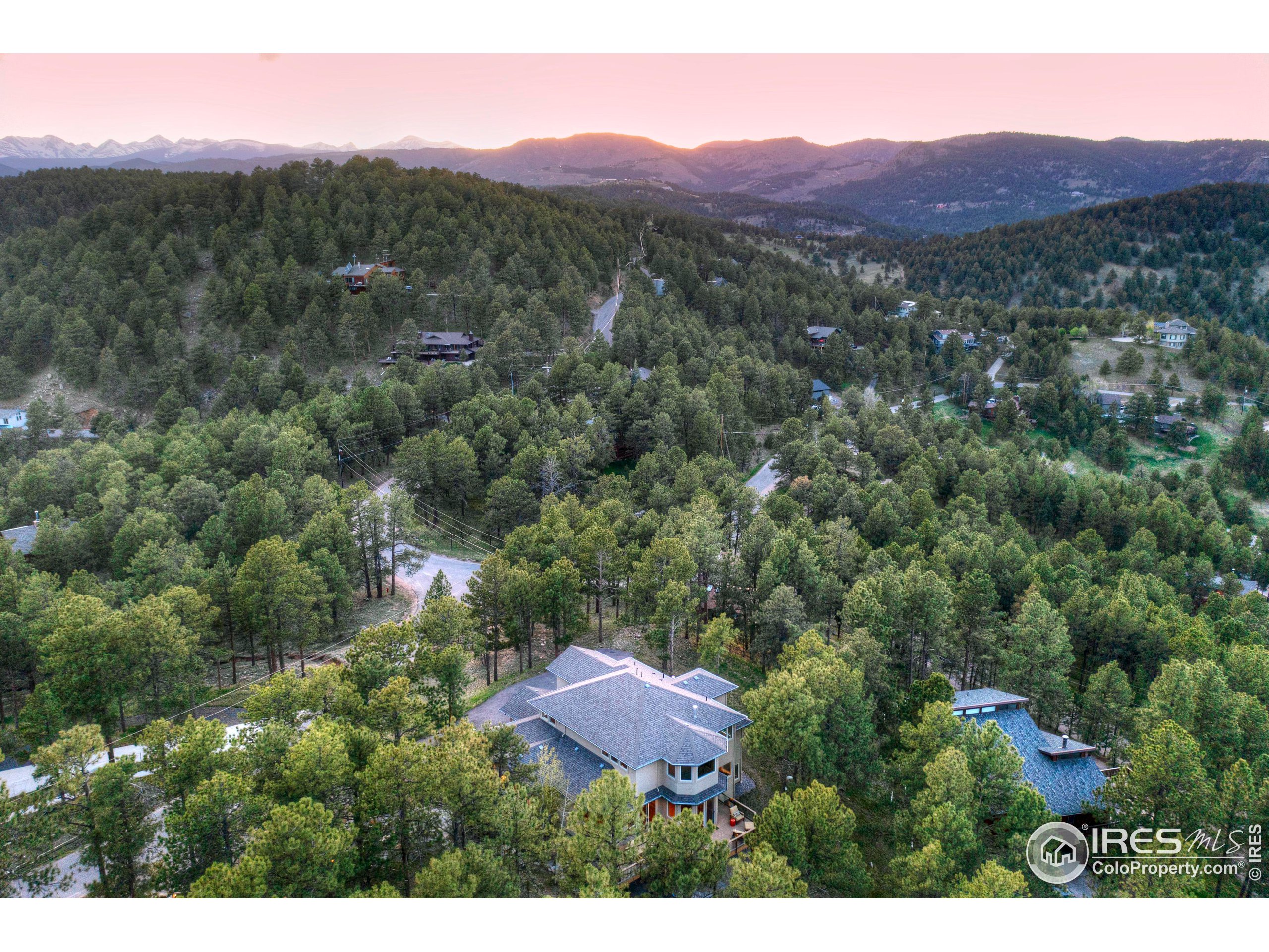 75 Alder Lane Boulder, CO 80304 - Photo 25 of 40 a view of a lush green hillside and a houses