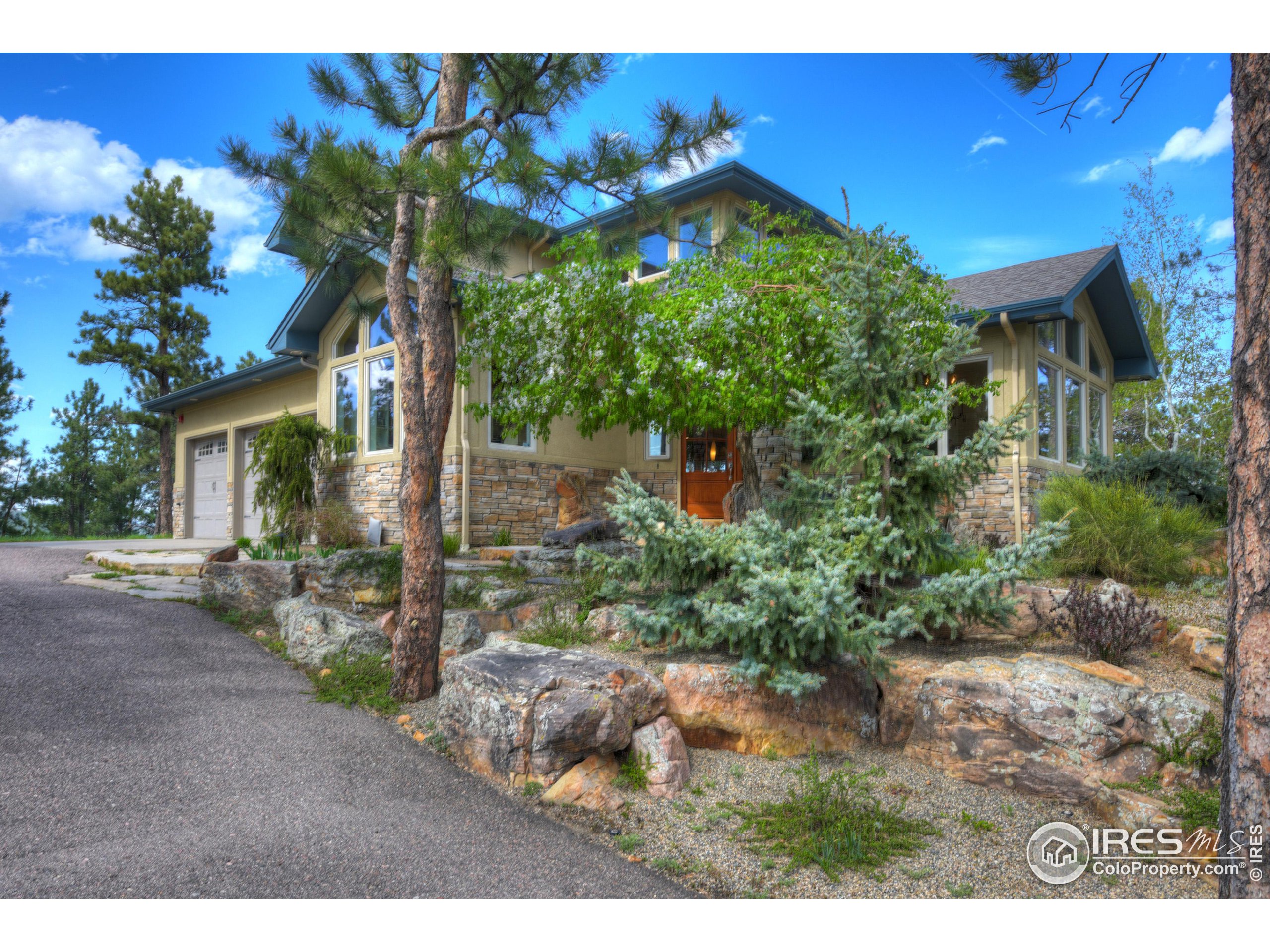 75 Alder Lane Boulder, CO 80304 - Photo 32 of 40 a view of a house with a yard and potted plants