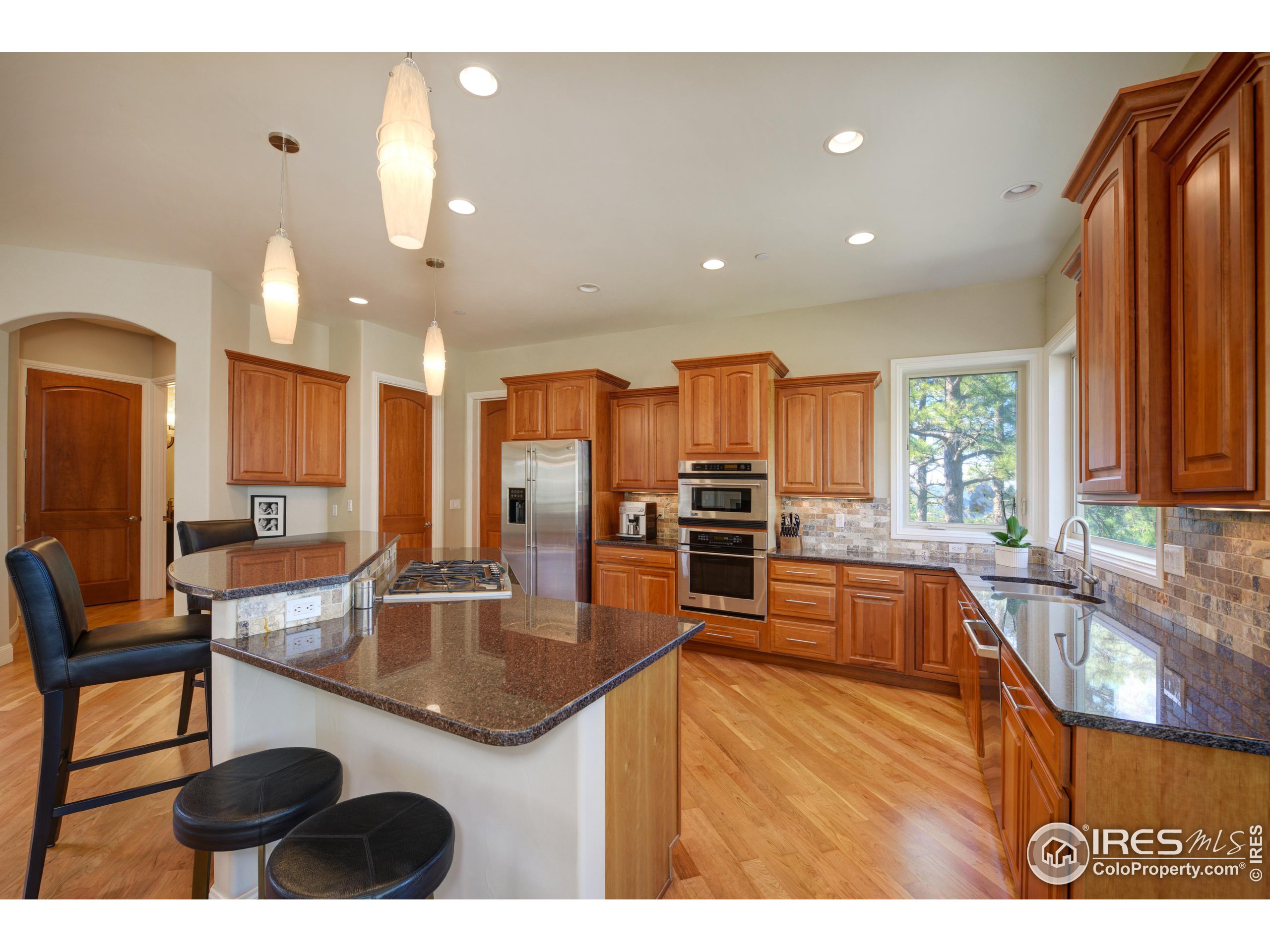 75 Alder Lane Boulder, CO 80304 - Photo 9 of 40 a kitchen with stainless steel appliances granite countertop a sink a stove and a refrigerator