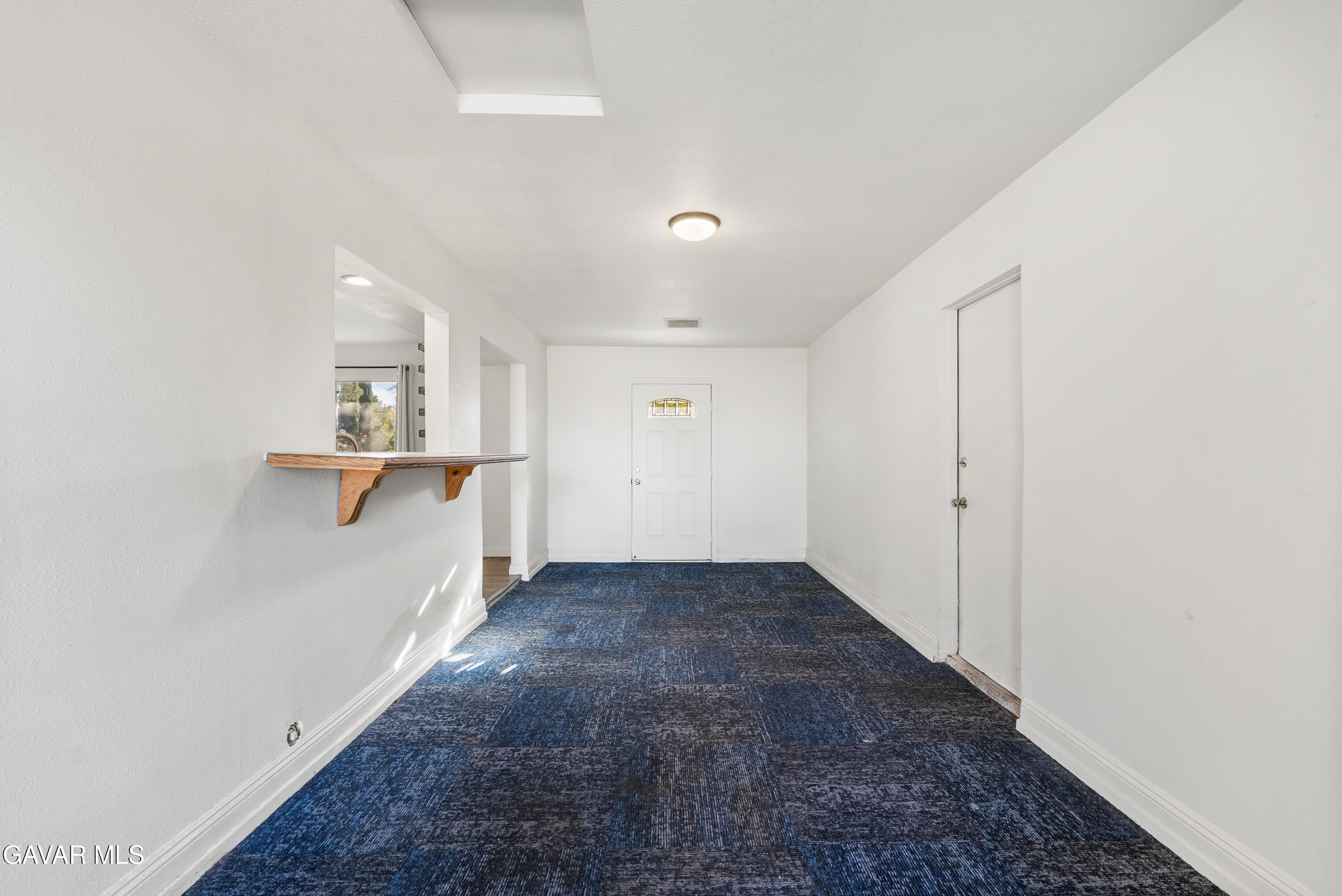 9459 East Ave T 2 Littlerock, CA 93543 - Photo 15 of 54 a view of a hallway with wooden floor