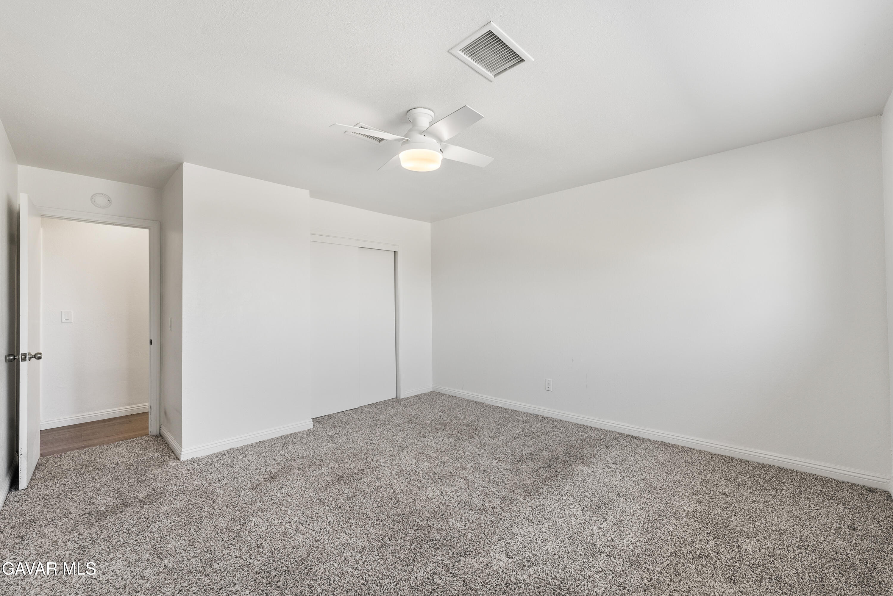 9459 East Ave T 2 Littlerock, CA 93543 - Photo 35 of 54 an empty room with a fan & a window