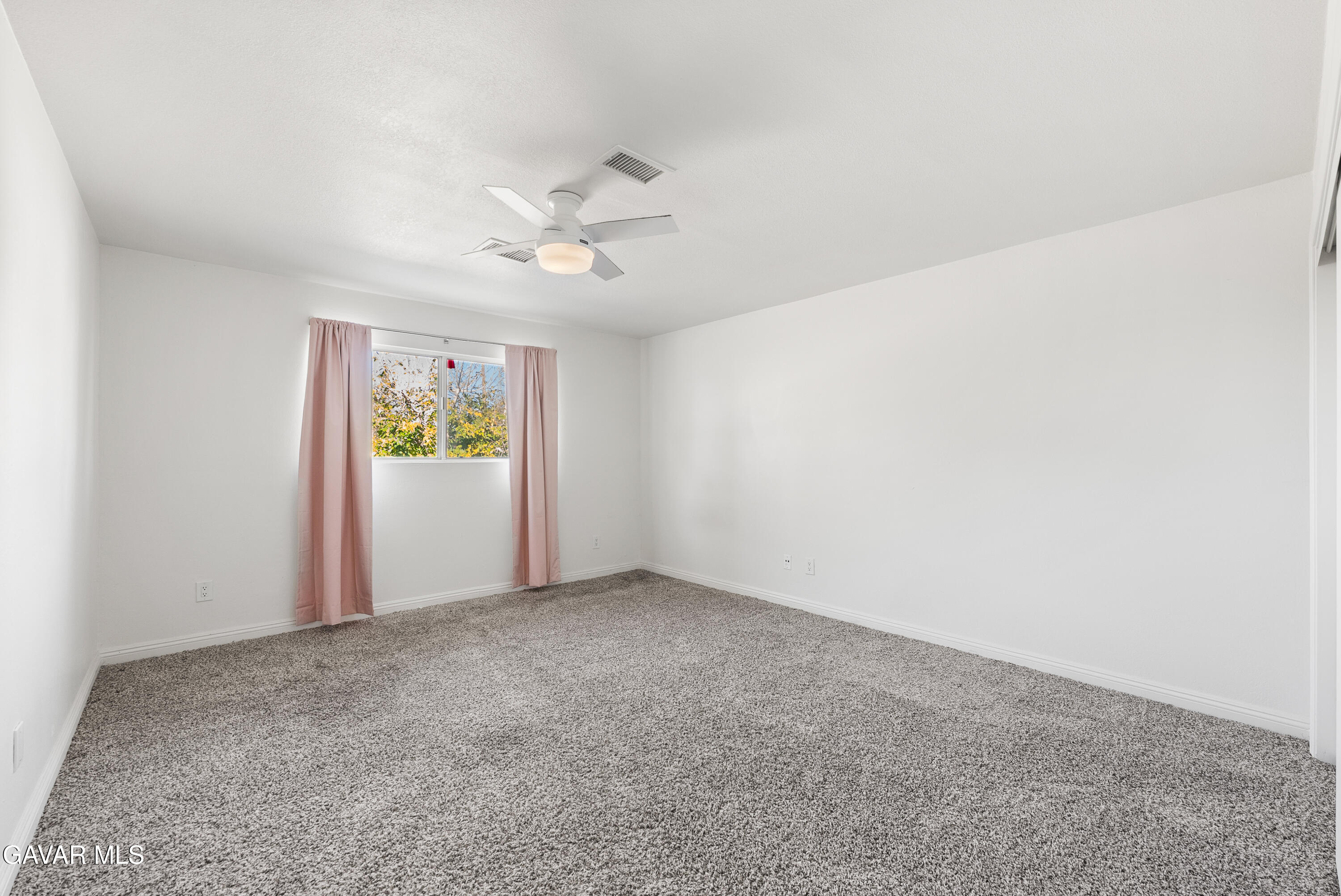 9459 East Ave T 2 Littlerock, CA 93543 - Photo 37 of 54 an empty room with windows and fan