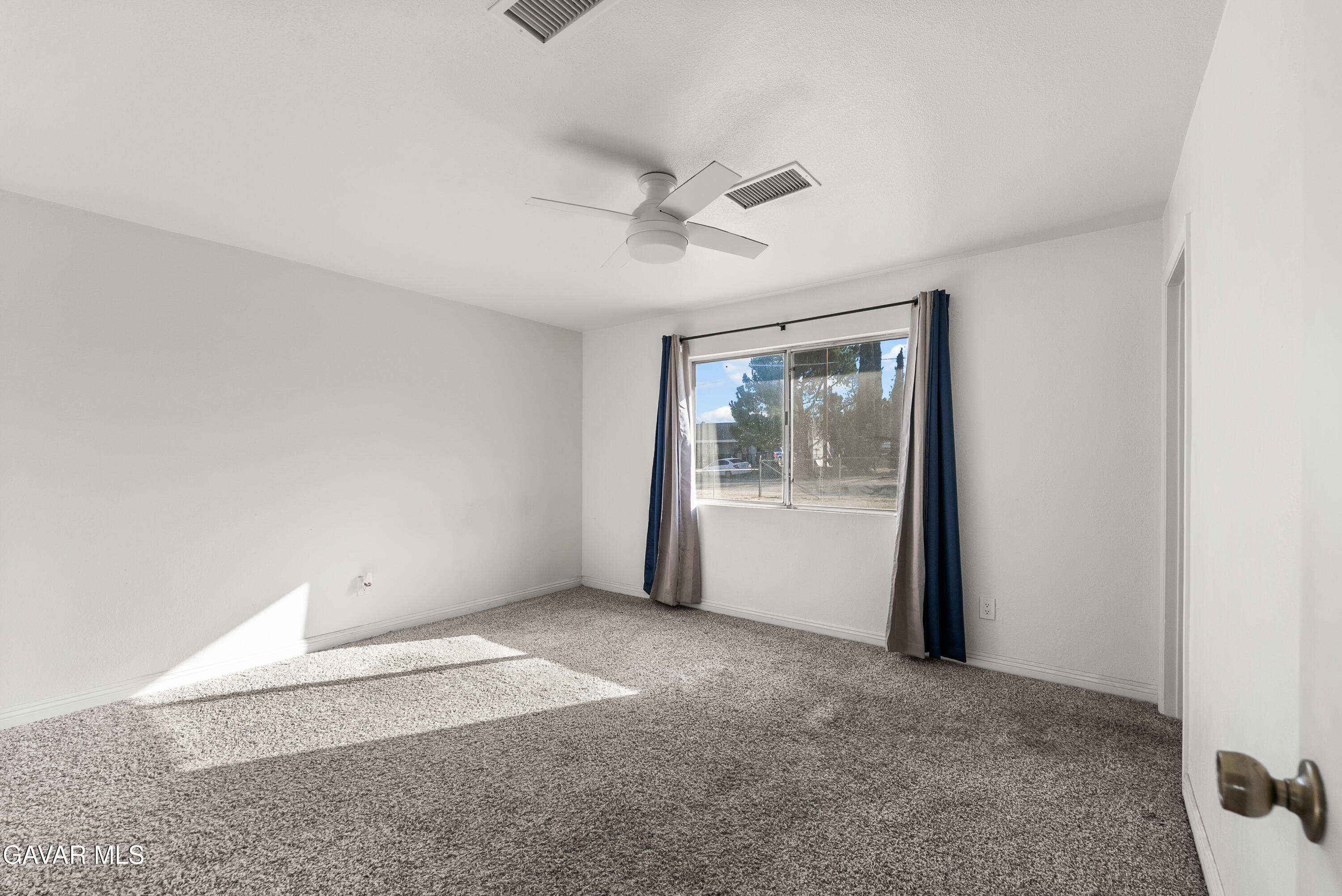 9459 East Ave T 2 Littlerock, CA 93543 - Photo 39 of 54 a view of a big room with wooden floor and windows in a room