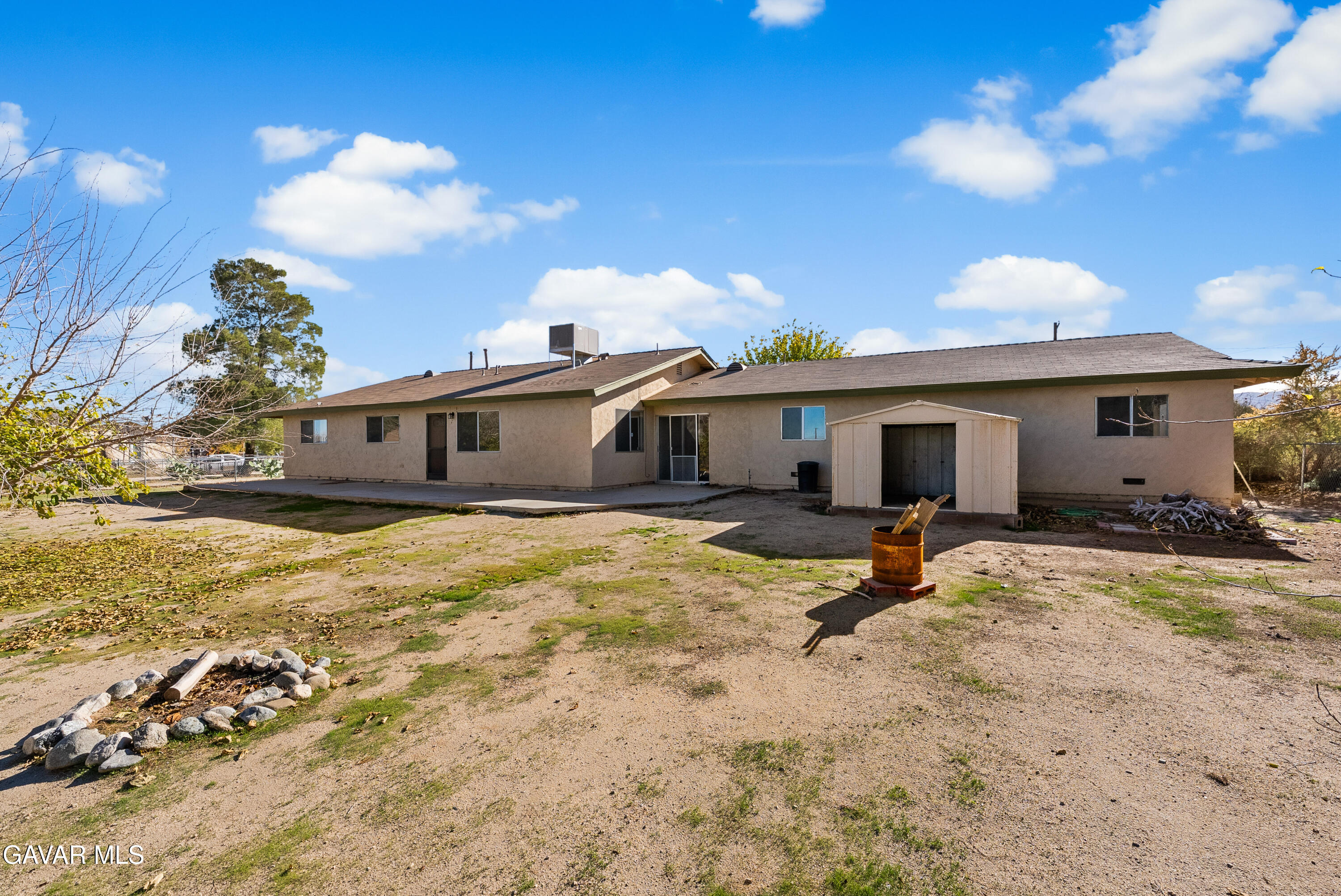 9459 East Ave T 2 Littlerock, CA 93543 - Photo 8 of 54 a view of a house with backyard and sitting area