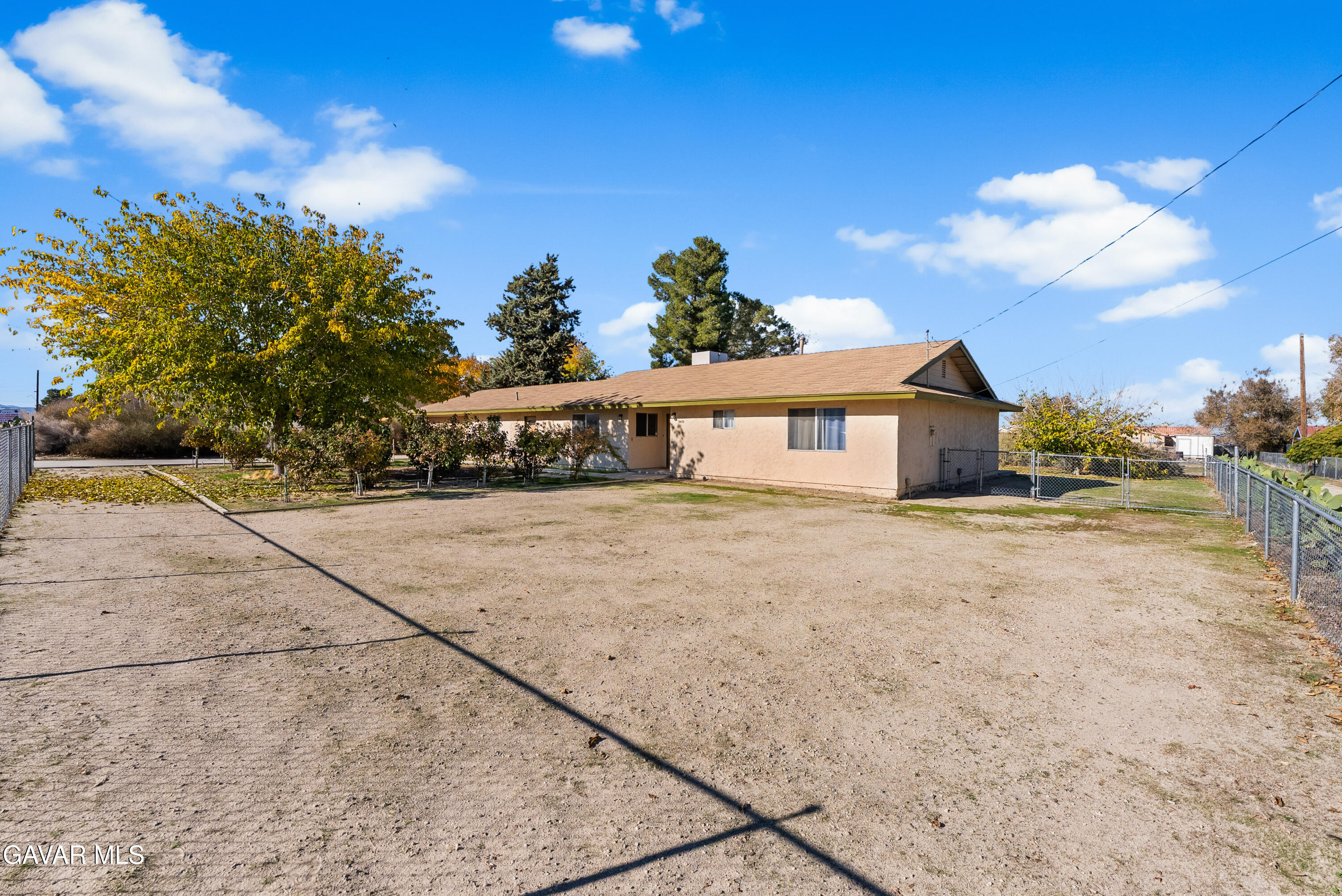 9459 East Ave T 2 Littlerock, CA 93543 - Photo 10 of 54 a front view of a house with a yard and garage