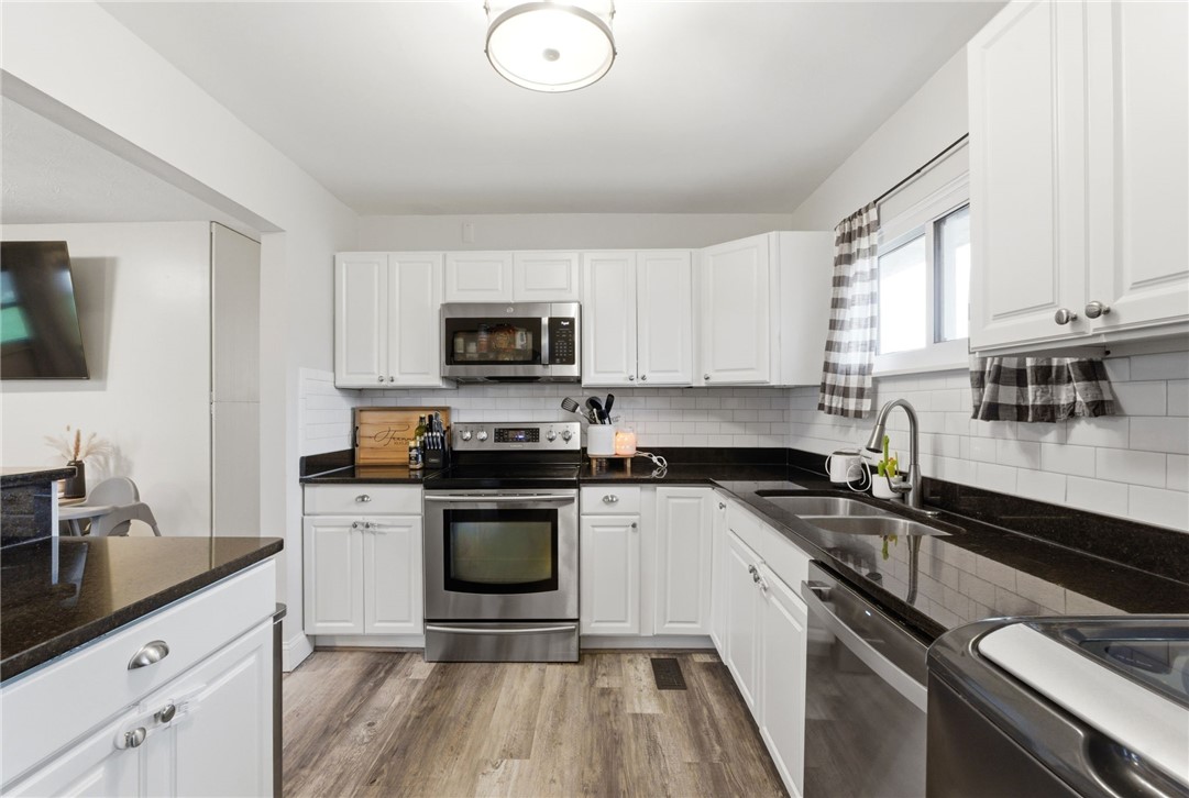 441 Townsend Place Riverside, OH 45431 - Photo 12 of 34 This modern kitchen features sleek countertops, stainless steel appliances, and ample cabinetry for all your culinary needs.
