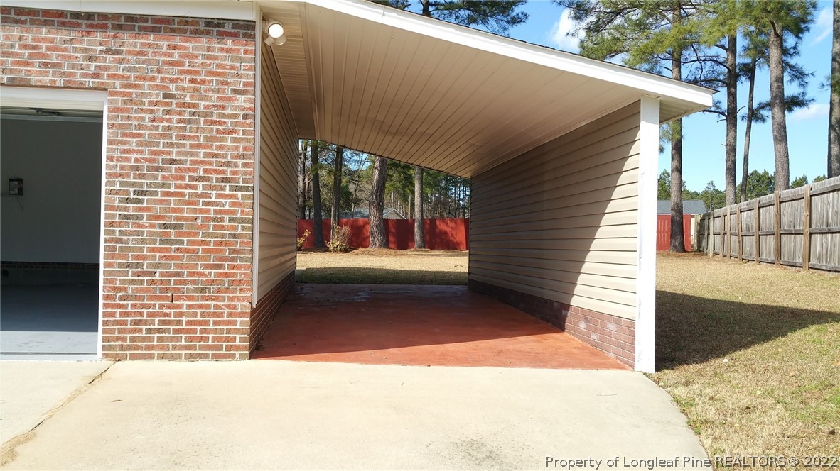 232 Rye Lane Raeford, NC 28376 - Photo 11 of 20 a view of a door of a house with a patio