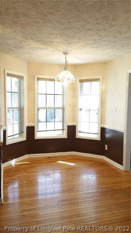 232 Rye Lane Raeford, NC 28376 - Photo 19 of 20 an empty room with wooden floor and windows