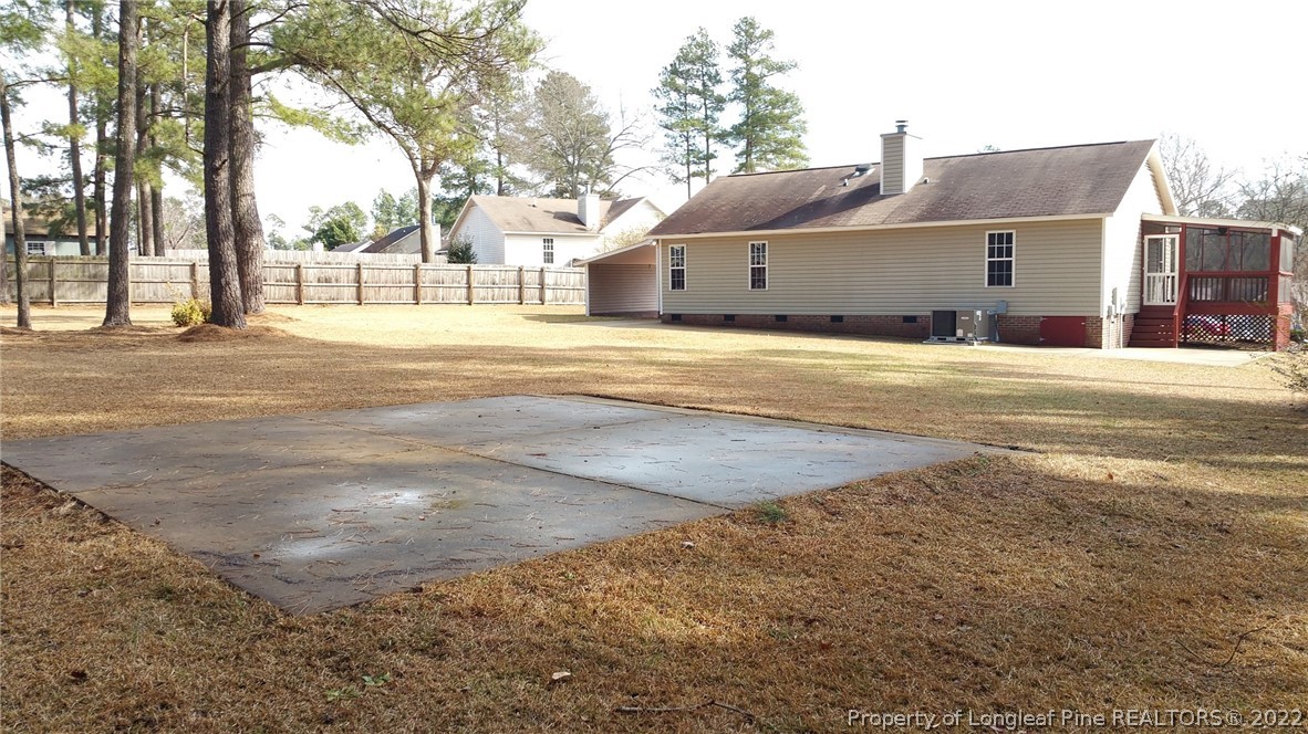 232 Rye Lane Raeford, NC 28376 - Photo 6 of 20 a front view of a house with a big yard and large trees