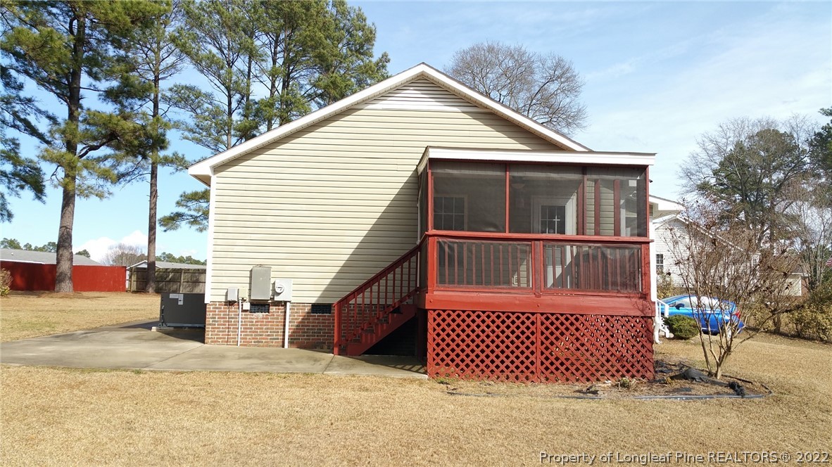 232 Rye Lane Raeford, NC 28376 - Photo 8 of 20 a view of a house with a yard