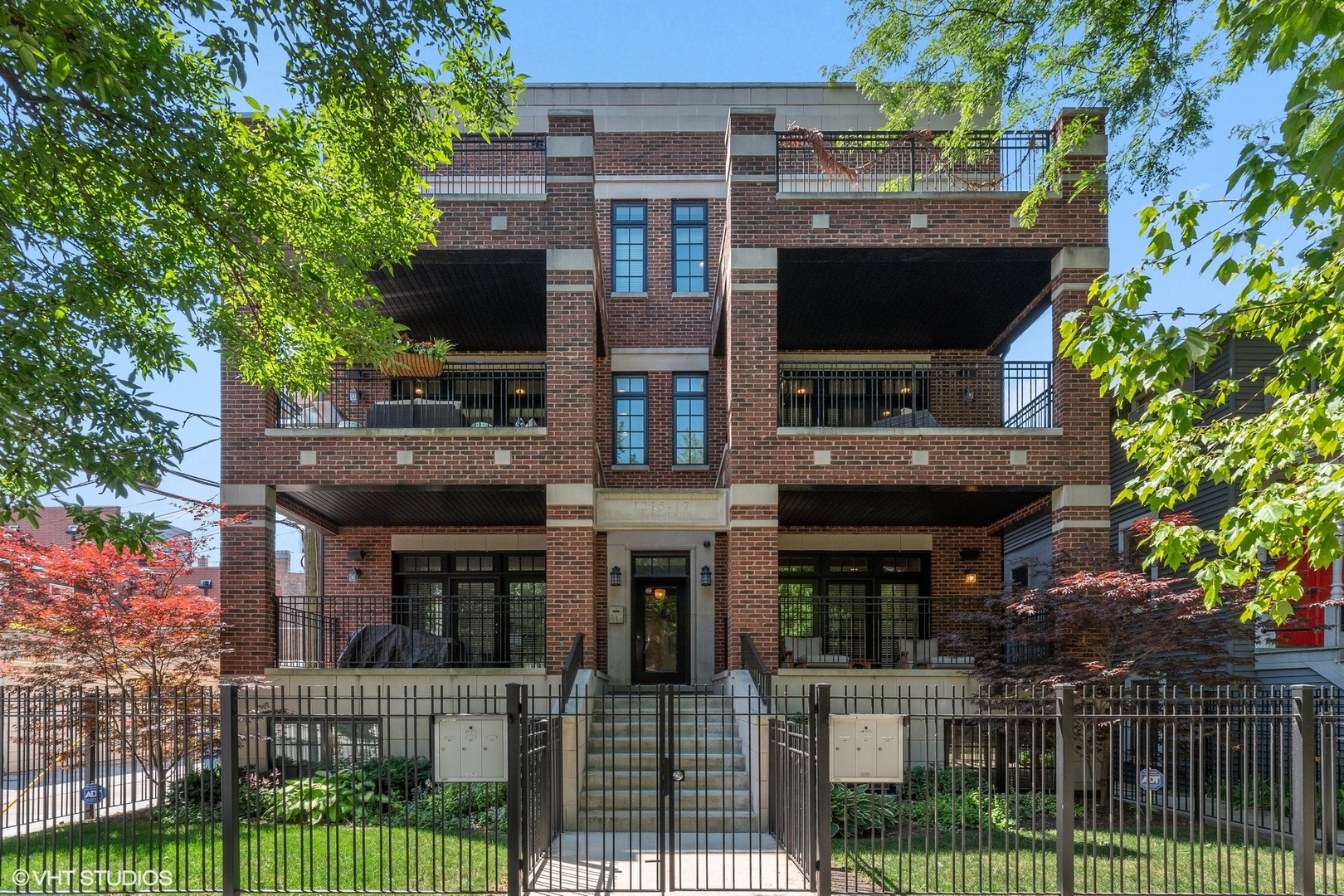 1215 West School Street, Unit 2E Chicago, IL 60657 - Photo 1 of 16 a front view of a house with a porch
