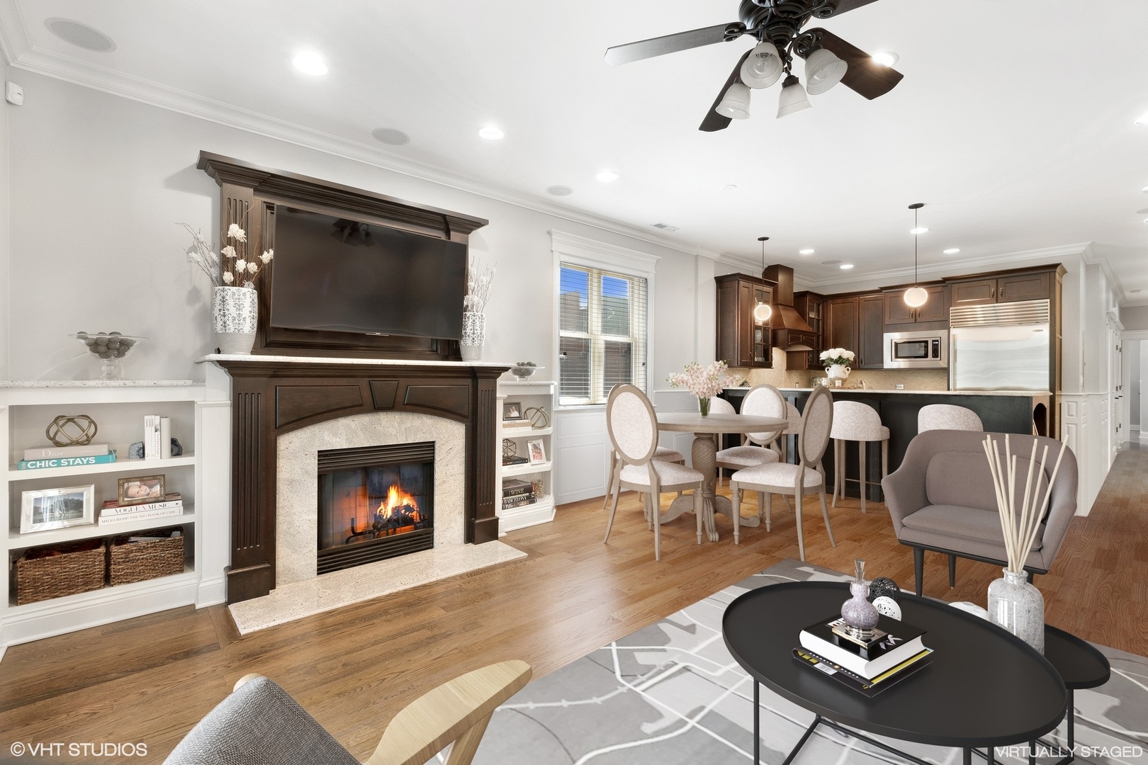 1215 West School Street, Unit 2E Chicago, IL 60657 - Photo 3 of 16 a living room with furniture a fireplace and a flat screen tv