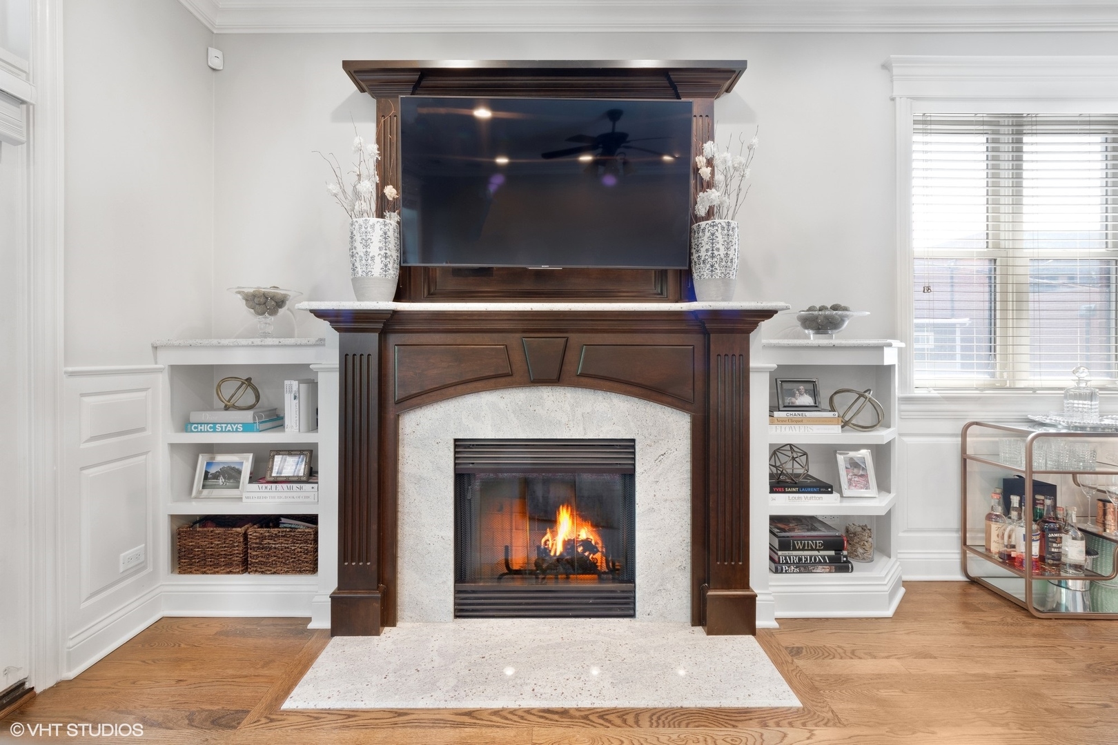 1215 West School Street, Unit 2E Chicago, IL 60657 - Photo 4 of 16 a living room with a fireplace a rug and a fireplace