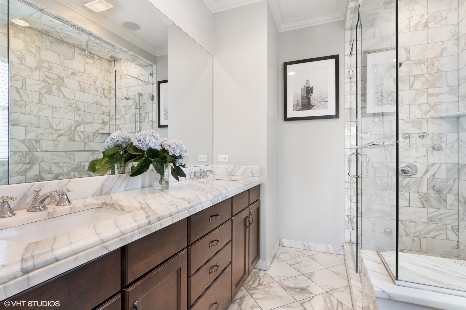 1215 West School Street, Unit 2E Chicago, IL 60657 - Photo 9 of 16 a bathroom with a granite countertop sink a mirror and shower