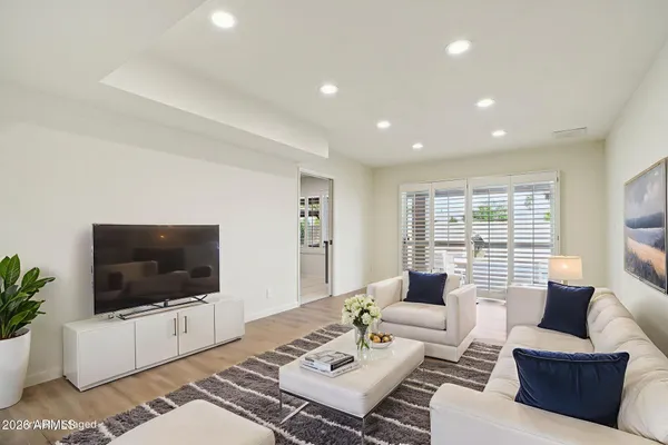 a living room with furniture and a large window