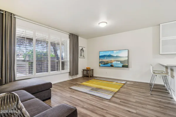 a view of a dining room with furniture window and wooden floor