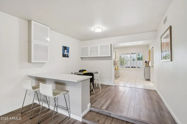 a kitchen with stainless steel appliances a refrigerator and a stove top oven