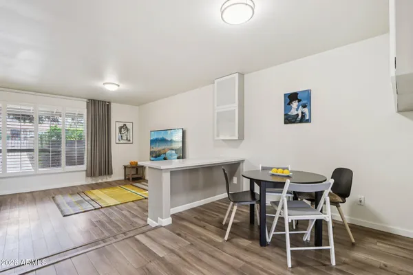 a kitchen with stainless steel appliances a sink a stove a refrigerator and cabinets