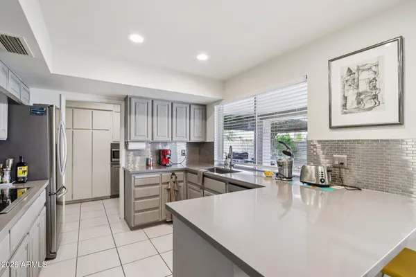 a bedroom with a bed and a television