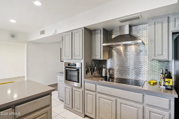 a bathroom with a shower and a glass door