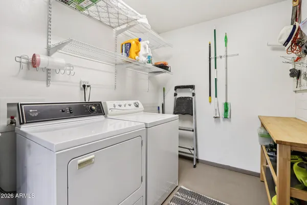 a bedroom with a bed and a mirror