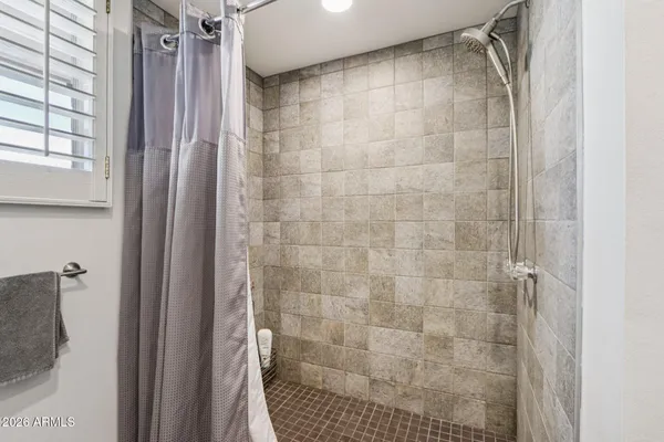 a bedroom with a bed and furniture