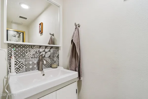 a backyard of a house with outdoor seating