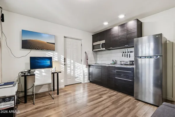 a view of a porch with furniture and a fire pit