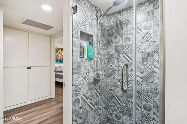 an aerial view of residential houses with outdoor space and parking