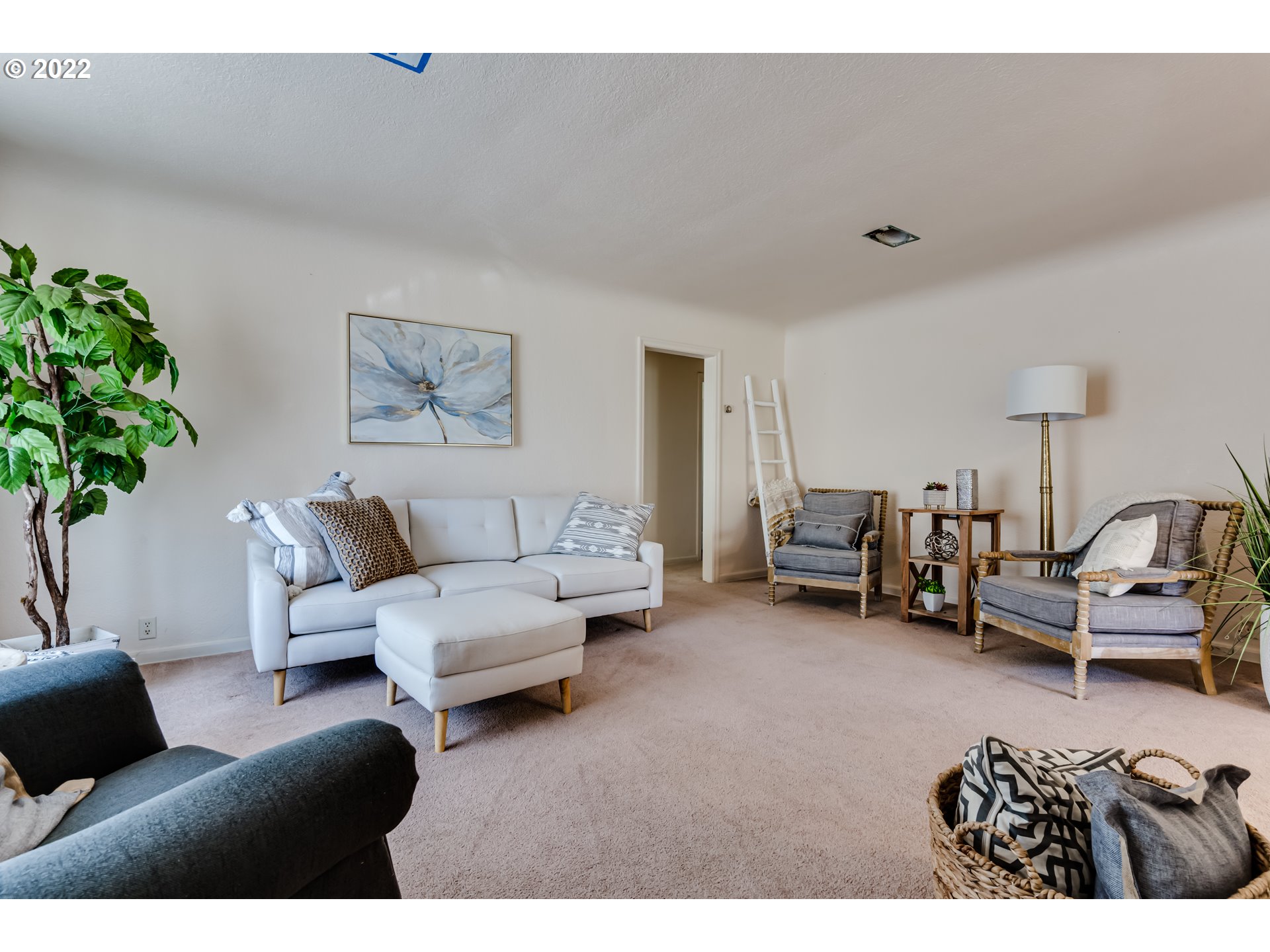 2691 Game Farm Road Springfield, OR 97477 - Photo 4 of 23 a living room with furniture a couch and a potted plant