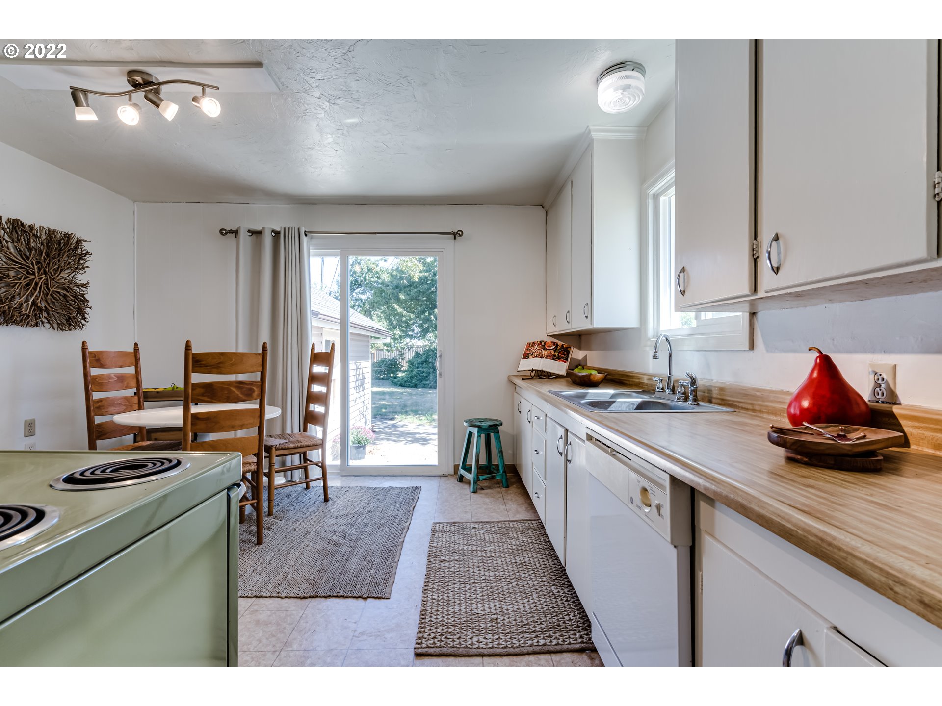 2691 Game Farm Road Springfield, OR 97477 - Photo 10 of 23 a kitchen with stainless steel appliances a stove a sink dishwasher and a microwave