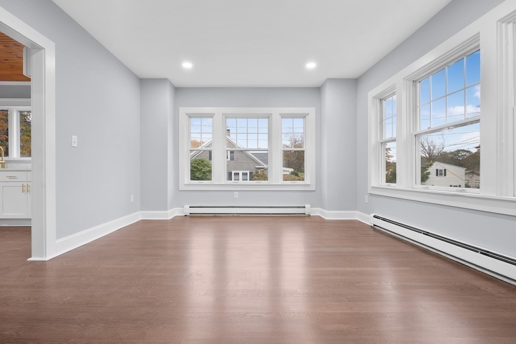 274 Archer Street Fall River, MA 02720 - Photo 14 of 29 a view of an empty room with a window and wooden floor
