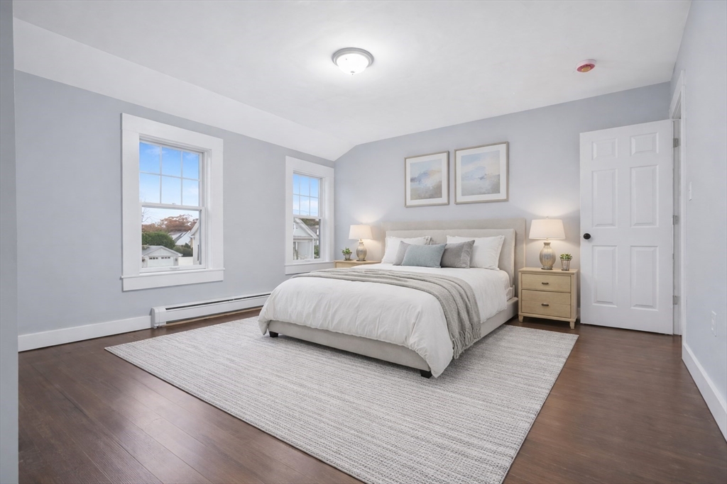 274 Archer Street Fall River, MA 02720 - Photo 20 of 29 a bedroom with a large bed and a painting on the wall