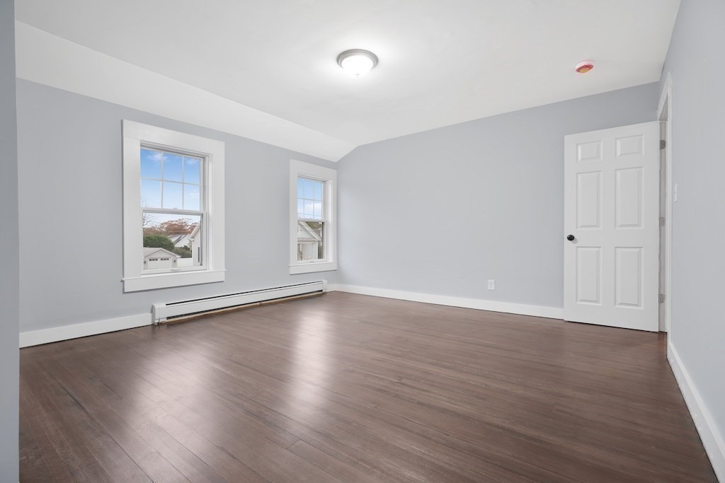 274 Archer Street Fall River, MA 02720 - Photo 21 of 29 a view of an empty room with wooden floor and a window