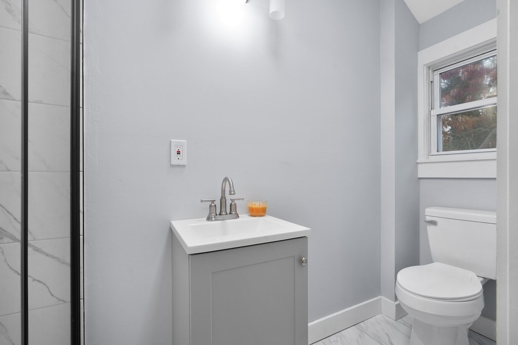 274 Archer Street Fall River, MA 02720 - Photo 26 of 29 a bathroom with a sink toilet and a mirror